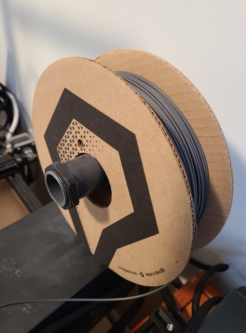 Filament spool Image of a spool of iron-filled PLA filament