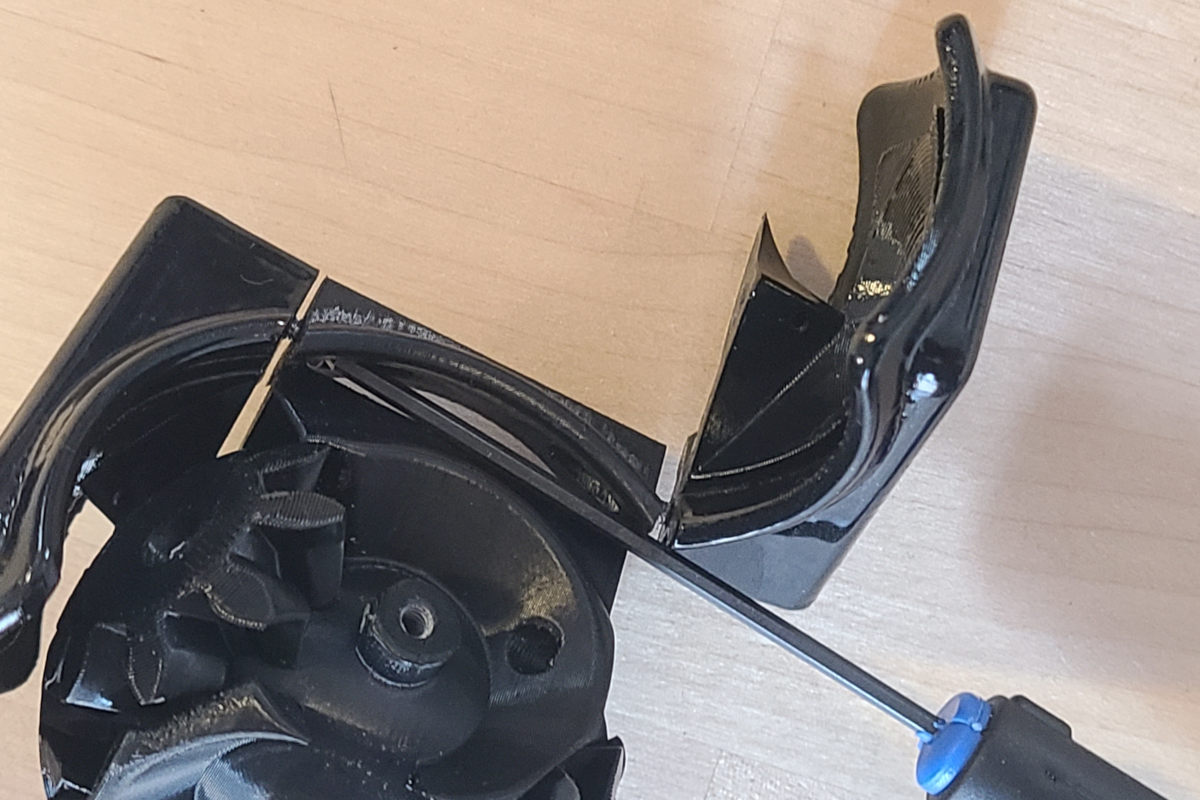 Use two M2 button head screws to begin attaching the wedge pieces Screw in the wedge pieces a little at a time